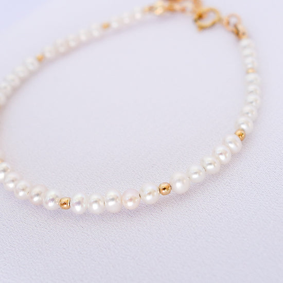 Tiny White Pearl Bracelet with Gold Accents